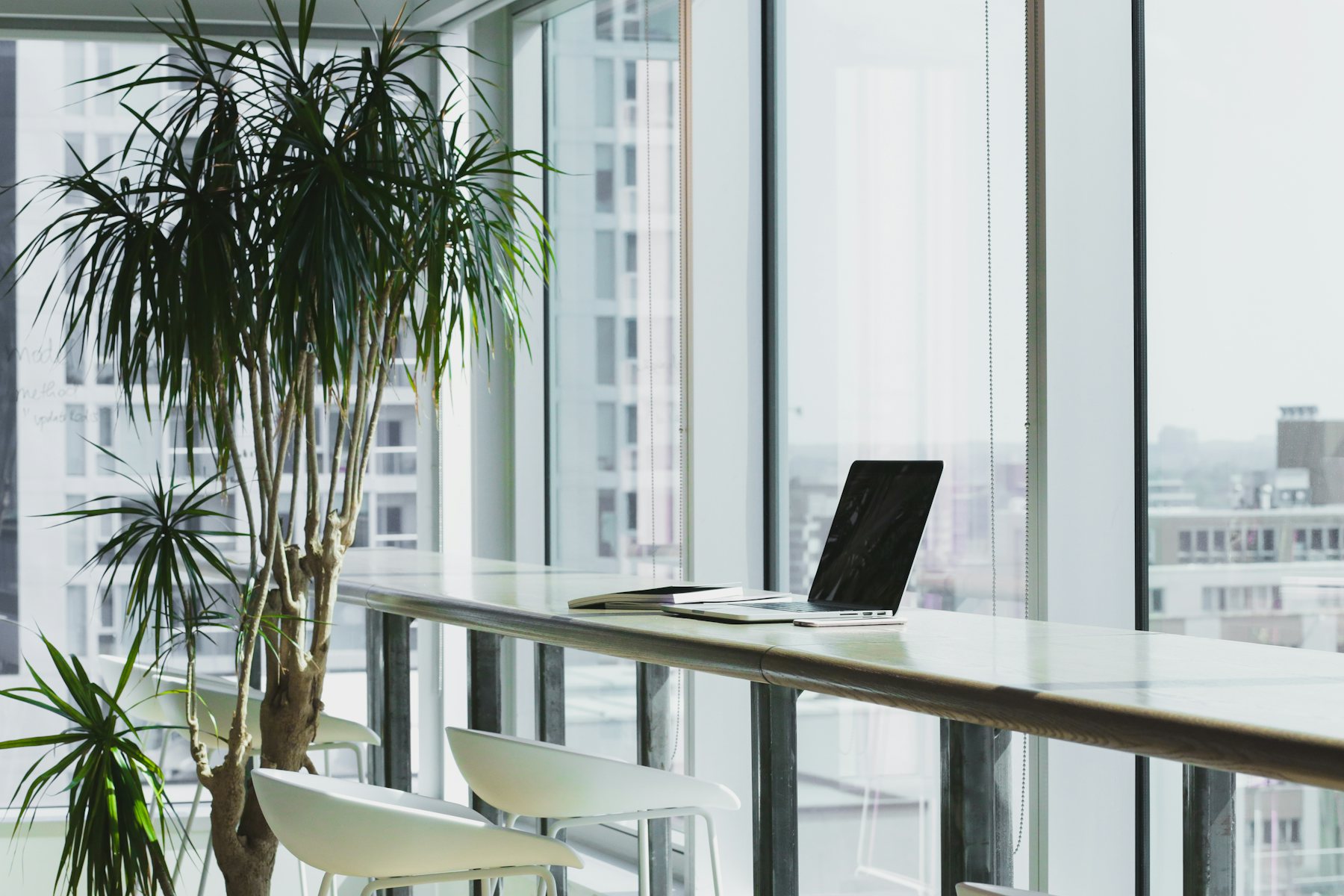 Minimalist private consultation room with a city skyline view
